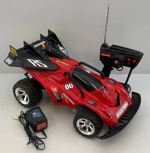 lot 36 image: Vintage Radio Shack RC Car With Remote & Charger (NEEDS BATTERIES)