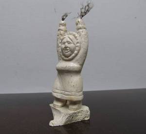 lot 40 image: Hand Carved EskimoInuit Carving by Alaskan Artist Ron Ekemo - Small Woman wFeathers