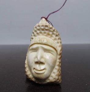 lot 41 image: Large Hand Carved Yupik Pendant