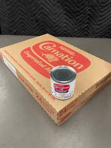 lot 217 image: Lot of 24 Nestl Carnation Evaporated Milk, 5 Fl Oz Cans