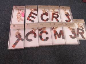 lot 125 image: 11 Monogram Keychains...