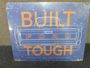 lot 558 image: Metal Built Ford Tough Sign 12.5x16...