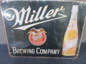lot 563 image: Metal Miller Sign 12.5x16 inches...