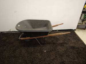 lot 89 image: Durable Wheelbarrow with Steel Frame and Wooden Handles