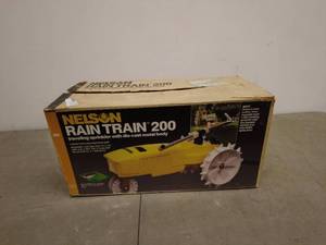 lot 99 image: Nelson Rain Train 200 Traveling Sprinkler with Die-Cast Metal Body