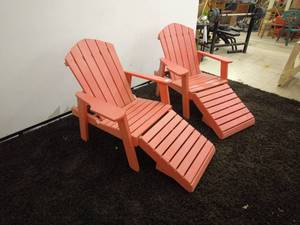 lot 103 image: pair of red Composite Adirondack chairs each with footrest extensions.