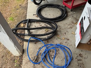 Two Sump Pump Discharge Hoses and Air Hose