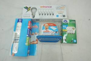 lot 10 image: New & opened 60 Watt bulbs and Mr. Clean Magic Eraser