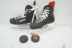 lot 119 image: Bauer Ice Skates Size 10 and two hockey pucks