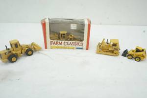 lot 180 image: Four Collectable Cat Construction Tractors