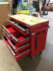 lot 1 image: Husky 42 in. W x 18.1 in. D 8-Drawer Red Mobile Workbench Cabinet with Solid Wood Top Customer Returns See Pictures