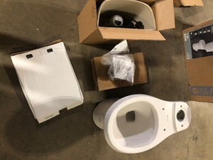 lot 11 image: Glacier Bay 12 inch Rough In Two-Piece 1.1 GPF1.6 GPF Dual Flush Round Toilet in White Seat Included    Customer Returns See Pictures