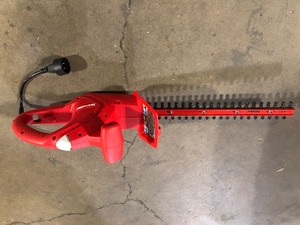 lot 34 image: Homelite 17 in. 2.7 Amp Electric Hedge Trimmer  Customer Returns See Pictures
