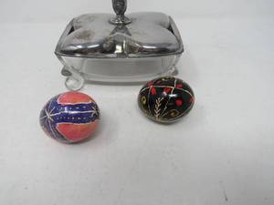 lot 133 image: eggs underglass  Pysanky in a footed crystal and silver plated covered box