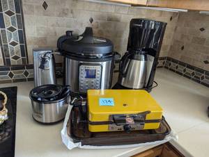 lot 174 image: Brand name Kitchen Must-haves Package  Cuisinart, waffle maker, electric canopener, Instapot, crockpot, pyrex