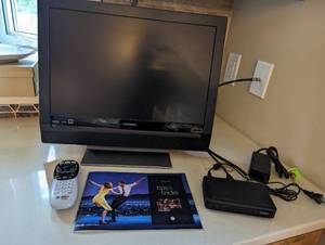 lot 178 image: Magnavox 19 TV on stand (kitchen) with direct TV accessories