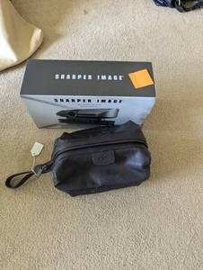 lot 209 image: Leather Mens Dopp Kit (new) and Motorized NIB tie rack from Sharper Image
