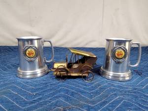 lot 16 image: 2 Aluminum 1987 Twins mugs with glass bottoms and a musical copper truck