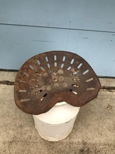 lot 201 image: Vintage Milk Can with Tractor Seat Welded to Milk Can