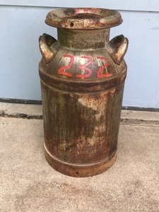lot 215 image: Vintage Metal Milk Can - Has Sanna Dairies Inc. etched into the side