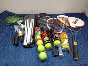lot 24 image: New badminton set, 4 tennis rackets and 5 containers of tennis balls