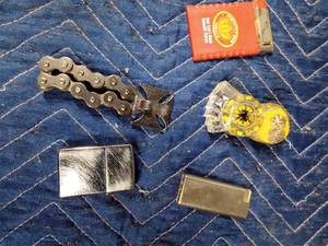 lot 184 image: 4 Lighters and a Chopper bottle opener