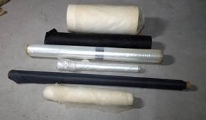 lot 164 image: Rolls of upholstery backing material and rolls of plastic