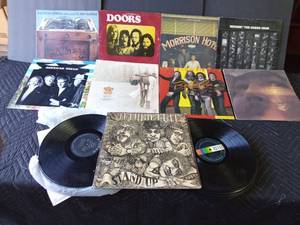 lot 128 image: Rock and roll LP records and 2 stacks of various artists out of their sleeves