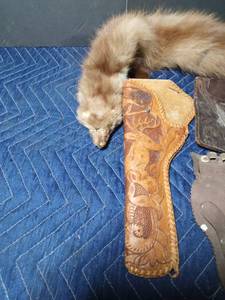 lot 37 image: Mink stole, 2 pistol holsters, 1 toy pistol holster
