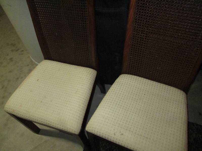 Pair of wood framed dining chairs with padded seat and wickered High Backs