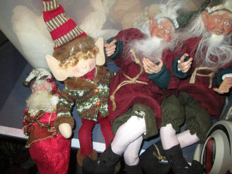 Covered tote with a collection of Christmas figures and decor