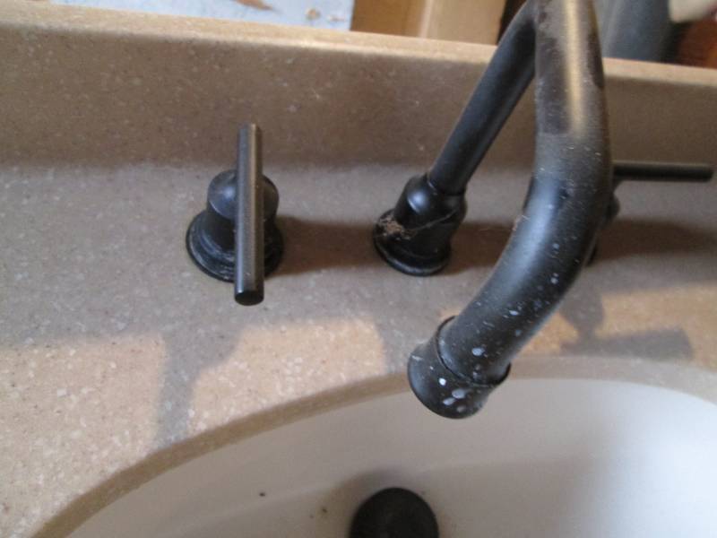 Placa Superficie Solida 3722 Sandstone Bathroom Countertop, under-mounted sink, oil rubbed Bronze faucet and handles plus the attached water lines