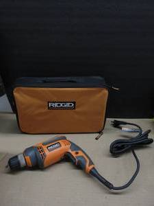 lot 208 image: Ridgid R70011 8 Amp 38 in. Corded DrillDriver With Bag NEW, TESTED, WORKS