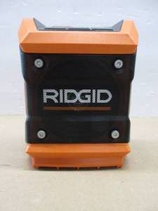 lot 423 image: Ridgid R84086B 18V Lithium Ion Cordless Mini Bluetooth Radio w Clock and USB Smart Phone Charging (Battery and Charger Not Included  Radio Only) - Slightly Used.