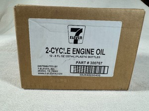 lot 145 image: Twelve Pack of 8 fluid ounce 2-Cycle Engine Oil
