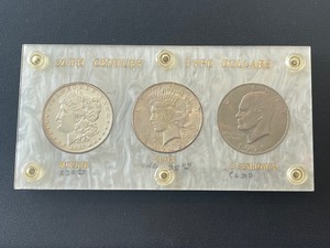 1896 Morgan, 1928-S Peace, and 1971-D Eisenhower Dollars