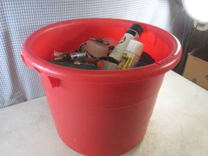 lot 37 image: (G-1) Large Tub With Misc - 2 Pocket Knives, Vent Hose, Tip-Up Carry Case, Assorted Small Organizer Boxes, Plasti Dip, Spray Paint, Bar Clamp and Air Nozzle