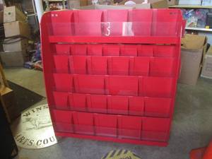 lot 76 image: (FRNT) Red Metal Display for Books or  - Dividers Are Adjustable and Removable - 48 W x 47 H x 15 D
