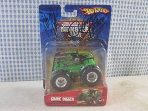 lot 92 image: (H-1) Daul Autographed Hot Wheels Monster Jam Grave Digger Truck by Dennis Anderson and Other