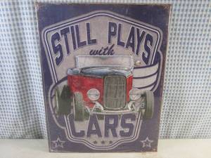 lot 187 image: (FS) Still Plays with Cars Tin Sign - New In Plastic Wrap - 16 x 12 12