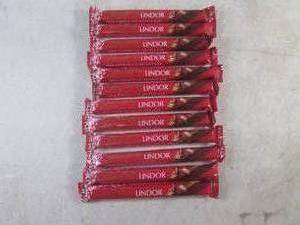 lot 232 image: (B-1) 12 Lindt Lindor Milk Chocolate Truffle Bars Best by April 2024