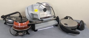 lot 9 image: Small Kitchen Appliances Ostba Meat Slicer, Flip Side Waffle Maker, Vintage Oster Fondue Pot, Vitantonio Tortilla Chef