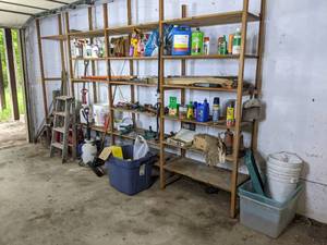 lot 103 image: A Variety of Garage Items Including Wooden Shelves, Garden Items, Gas Jugs, Keys and More