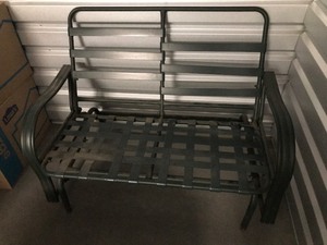 lot 73 image: Metal Glider Patio Loveseat, Measuring 48 X 32 X 36 Cushion Included Not Shown In Picture