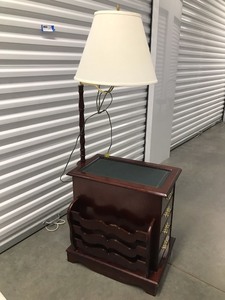 lot 88 image: Four Drawer Wood Side Table With Attached Magazine, Measuring 3 X 13 X 22 And 55 With The Lamp