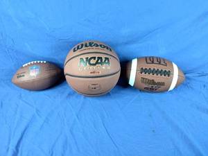 lot 127 image: 2 New Wilson Footballs and 1 Wilson Basketball