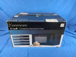 lot 148 image: New Kenmore 1.1 cu-ft Black Microwave - Black
