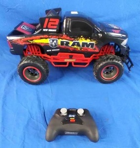 lot 204 image: New Bright (110) RAM Battery Radio Control Black Truck,
