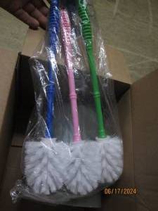 lot 8 image: new bathroom items waste basket, shower curtain and new bowl brushes