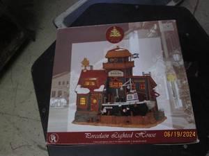 lot 92 image: porcelain lighted house...
